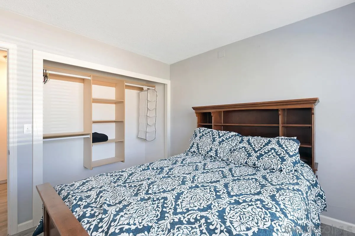 24567 Adams Avenue Murrieta, CA 92562 - Photo 21 of 42 a bedroom with a large bed and a window