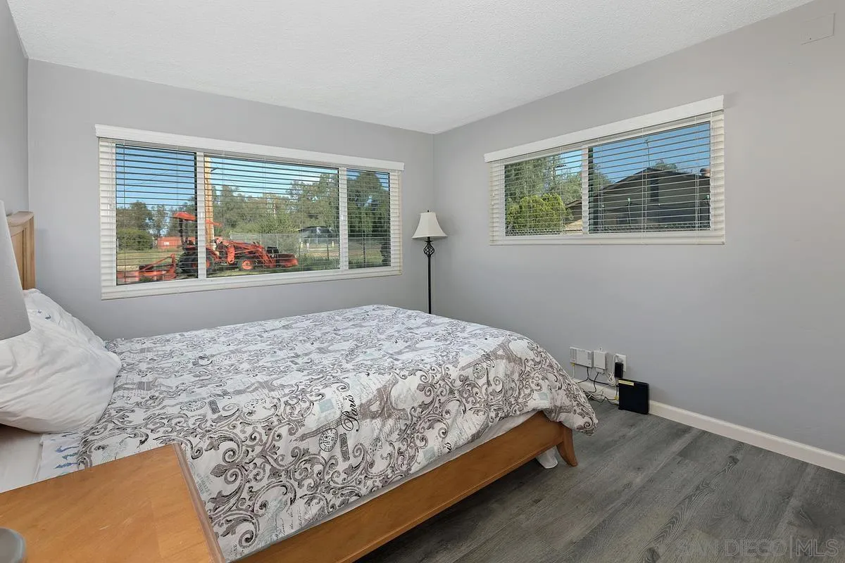24567 Adams Avenue Murrieta, CA 92562 - Photo 22 of 42 a bed sitting in a bedroom next to a window