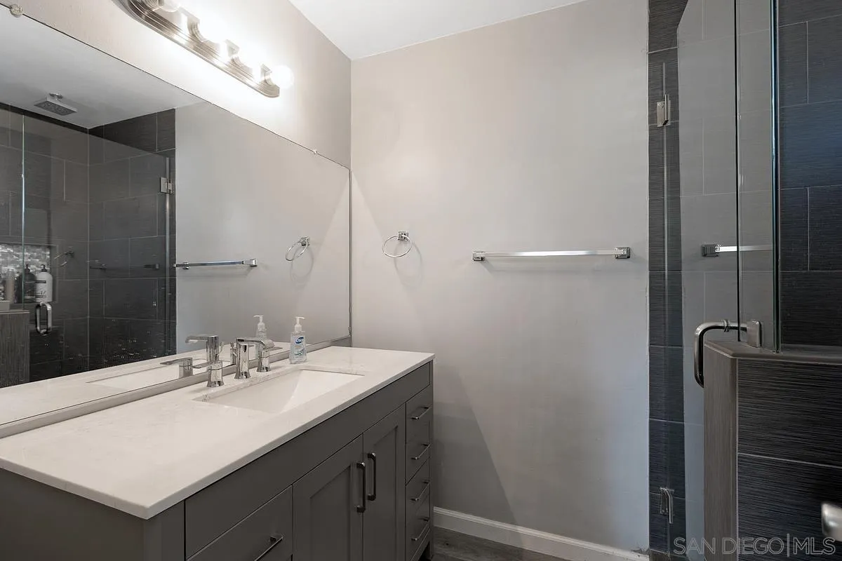 24567 Adams Avenue Murrieta, CA 92562 - Photo 26 of 42 a bathroom with a sink and a mirror