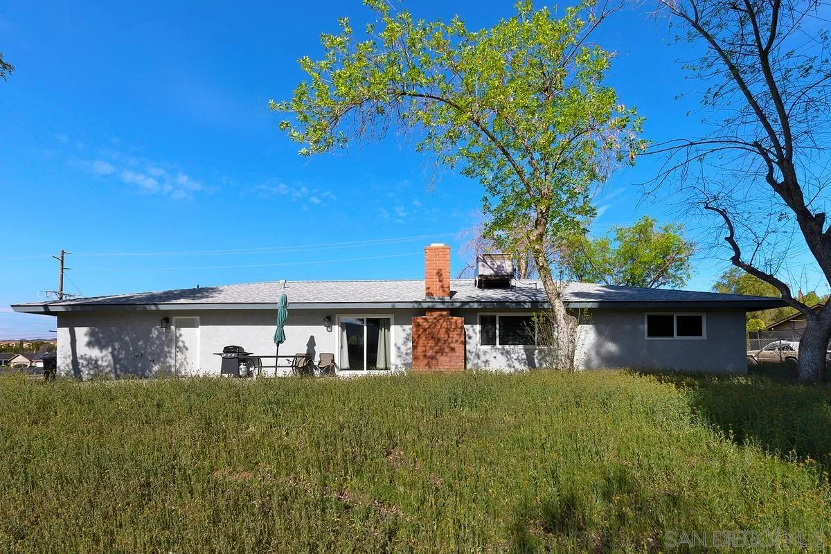 24567 Adams Avenue Murrieta, CA 92562 - Photo 33 of 42 a front view of a house with a garden