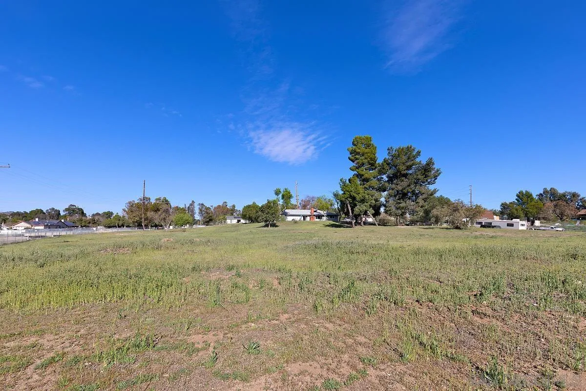 24567 Adams Avenue Murrieta, CA 92562 - Photo 38 of 42 a view of a field with a tree in the background