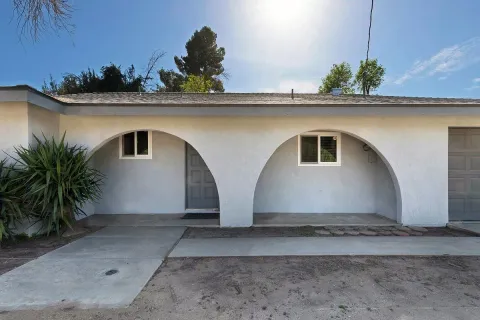 a house with a lot of plants