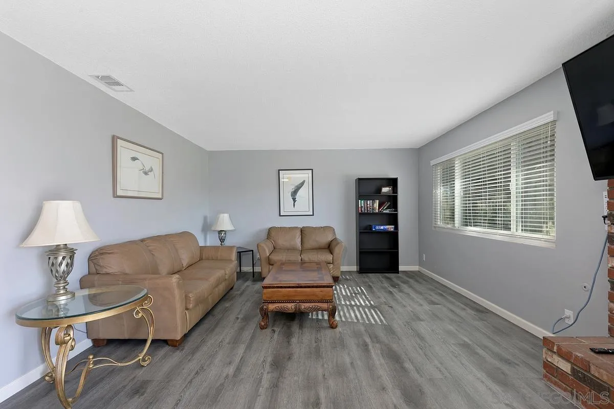 24567 Adams Avenue Murrieta, CA 92562 - Photo 8 of 42 a living room with furniture and a flat screen tv