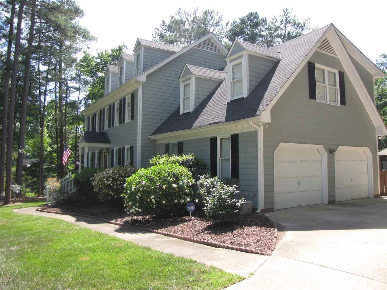 15800 Possum Track Road Raleigh, NC 27614 - Photo 2 of 25 a front view of a house with a yard and a garage