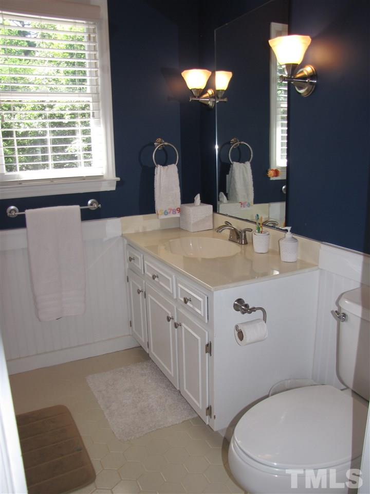 15800 Possum Track Road Raleigh, NC 27614 - Photo 14 of 25 a bathroom with a granite countertop toilet sink and mirror