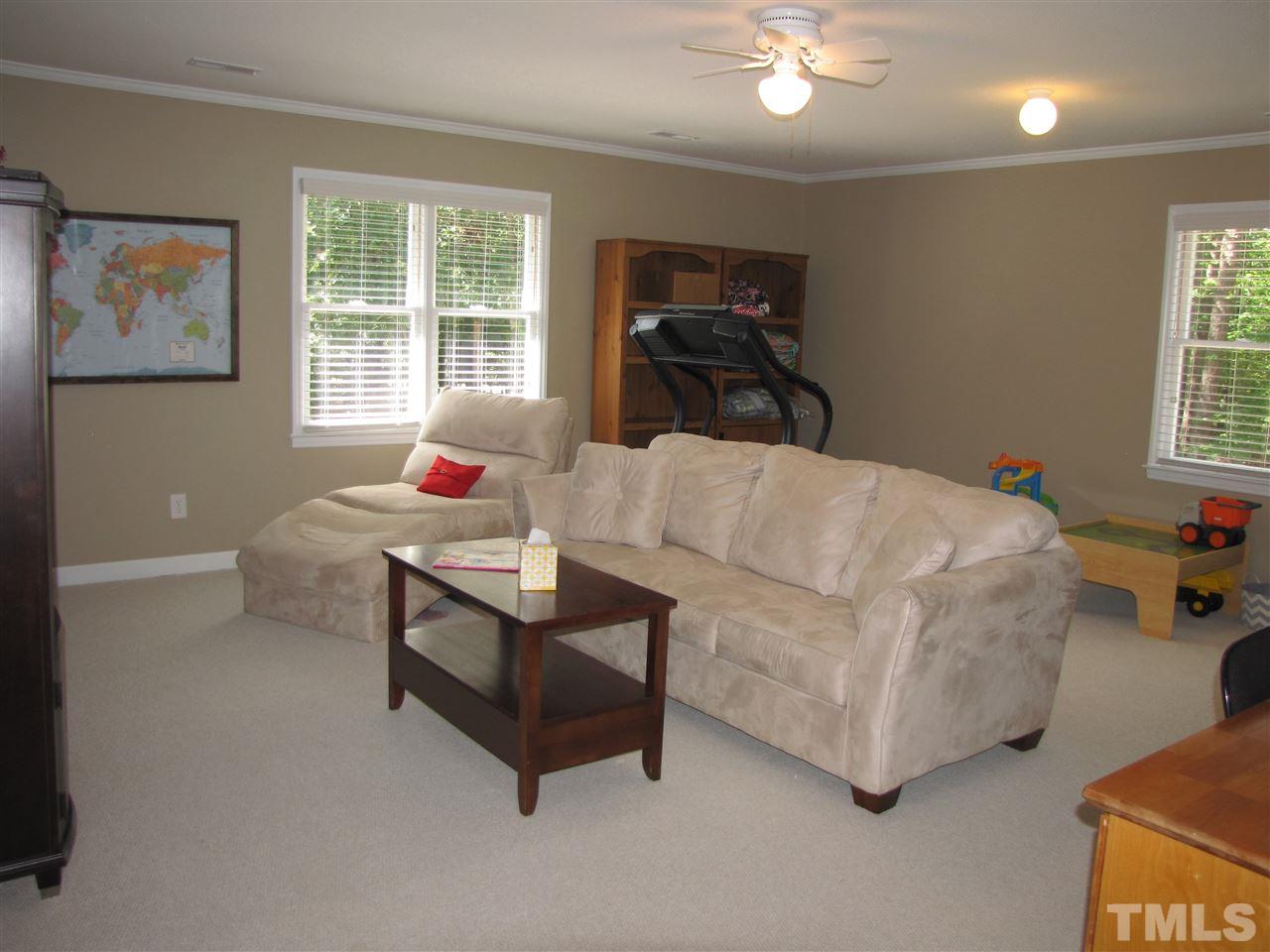 15800 Possum Track Road Raleigh, NC 27614 - Photo 15 of 25 a living room with furniture and a window