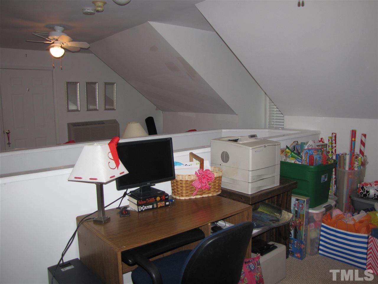 15800 Possum Track Road Raleigh, NC 27614 - Photo 18 of 25 a view of a workspace with furniture