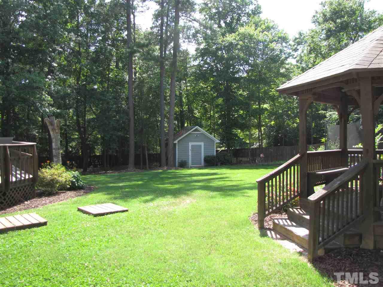 15800 Possum Track Road Raleigh, NC 27614 - Photo 20 of 25 a view of a deck with a backyard