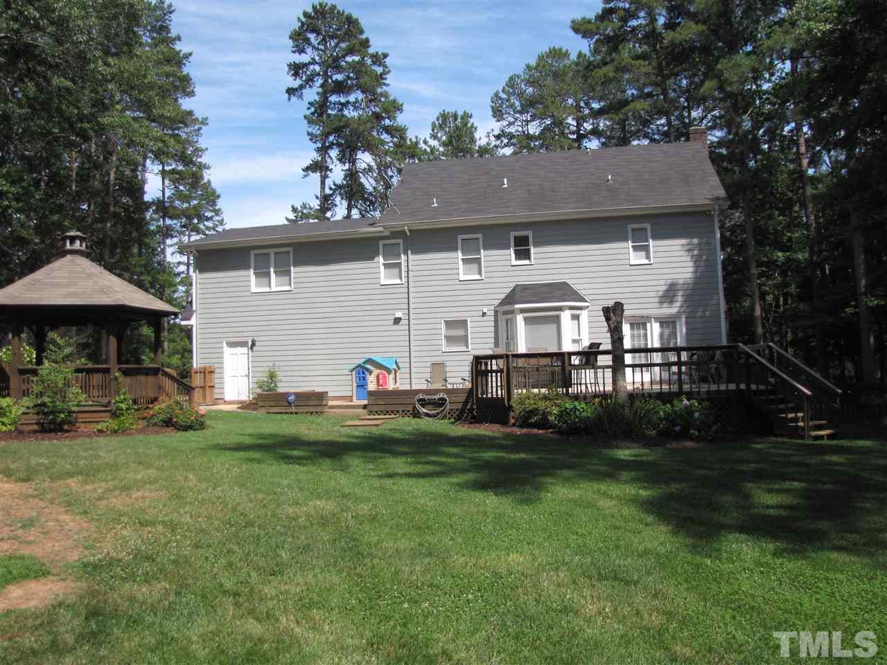 15800 Possum Track Road Raleigh, NC 27614 - Photo 22 of 25 a view of house with backyard and outdoor seating