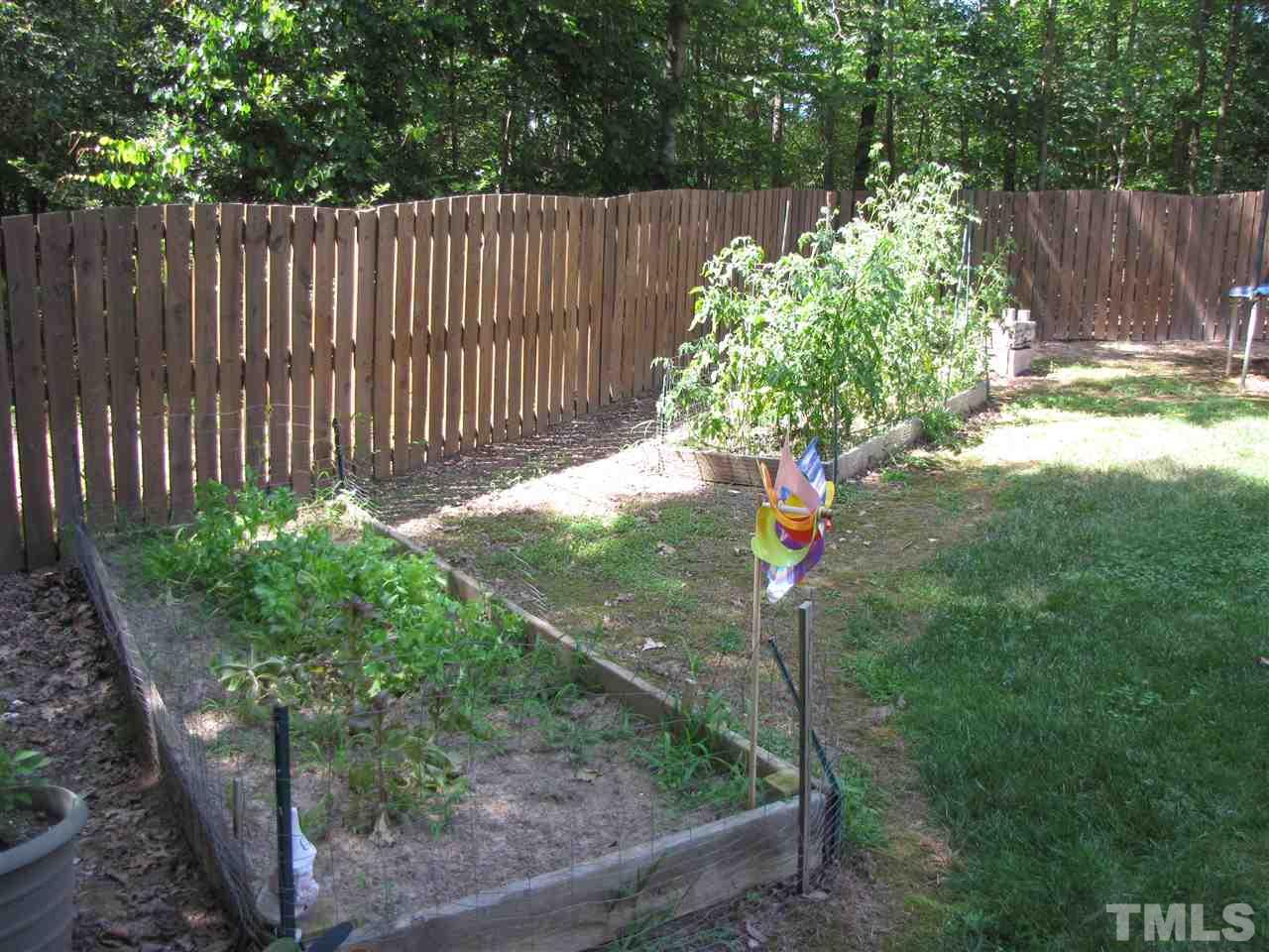 15800 Possum Track Road Raleigh, NC 27614 - Photo 23 of 25 a backyard of a house with lots of green space
