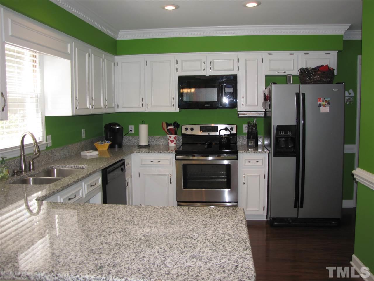 15800 Possum Track Road Raleigh, NC 27614 - Photo 6 of 25 a kitchen with stainless steel appliances granite countertop a refrigerator and a stove