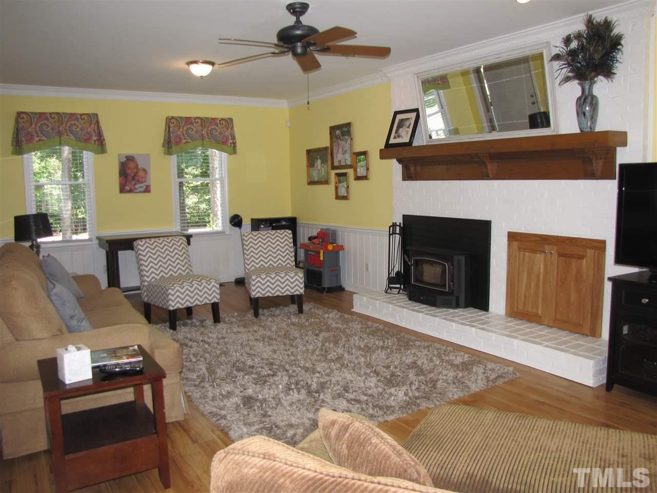 15800 Possum Track Road Raleigh, NC 27614 - Photo 8 of 25 a living room with furniture and a fireplace