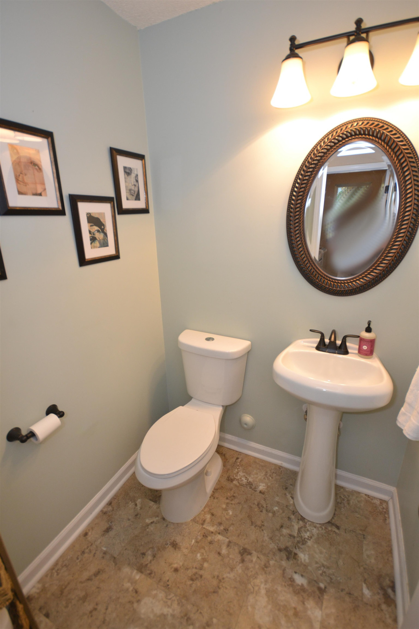 5501 Cardinal Grove Boulevard Raleigh, NC 27616 - Photo 11 of 37 a bathroom with a sink toilet and mirror