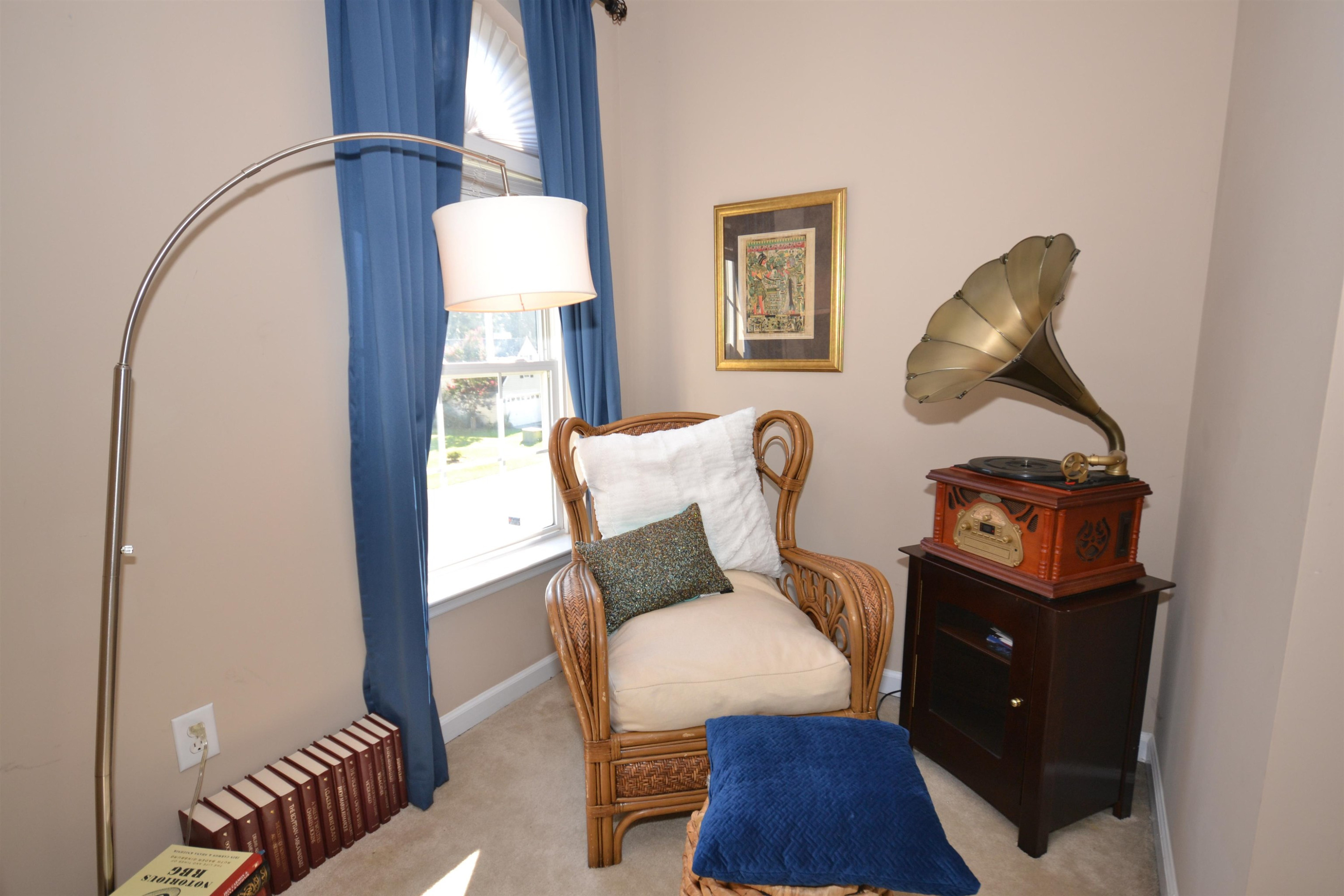 5501 Cardinal Grove Boulevard Raleigh, NC 27616 - Photo 14 of 37 a living room with furniture and wooden floor