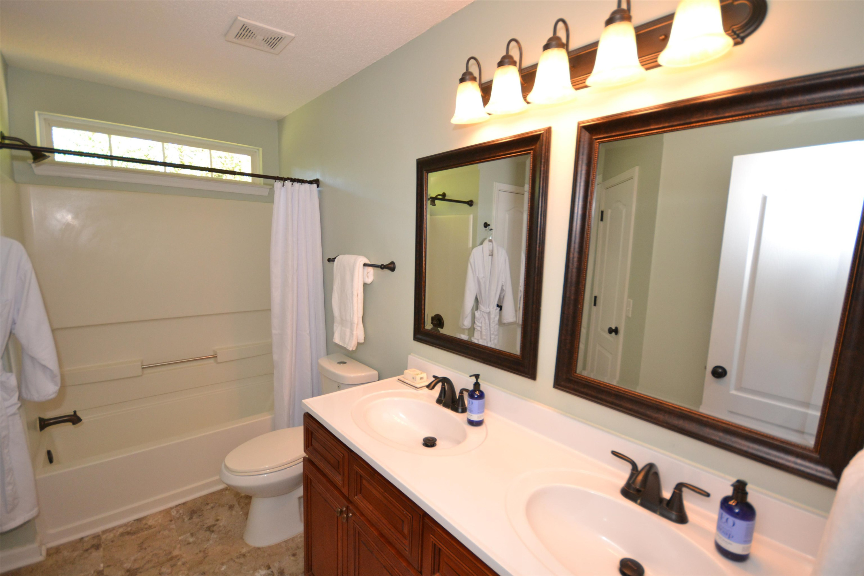 5501 Cardinal Grove Boulevard Raleigh, NC 27616 - Photo 16 of 37 a bathroom with a sink a toilet and shower