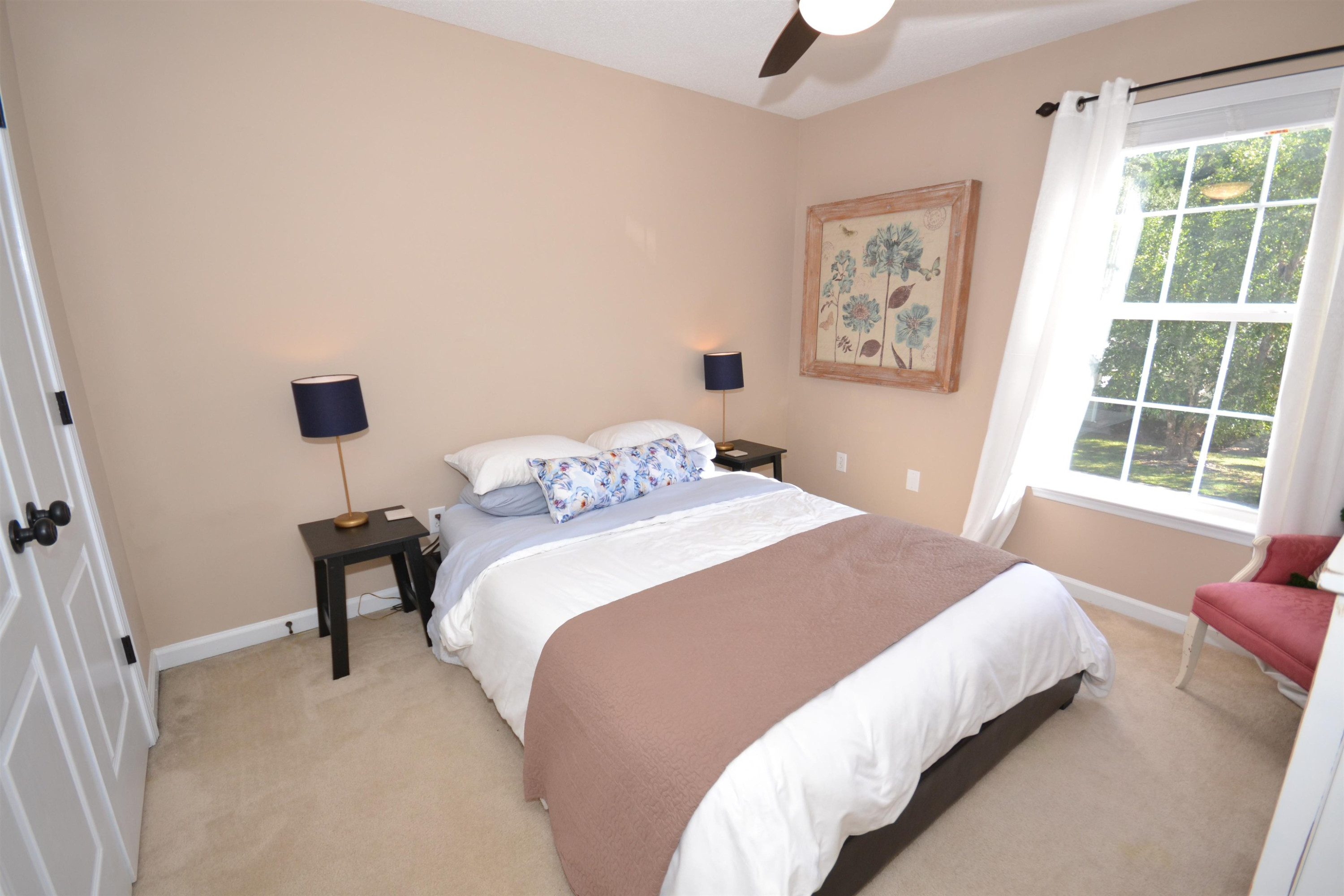 5501 Cardinal Grove Boulevard Raleigh, NC 27616 - Photo 17 of 37 a bedroom with a bed and a window