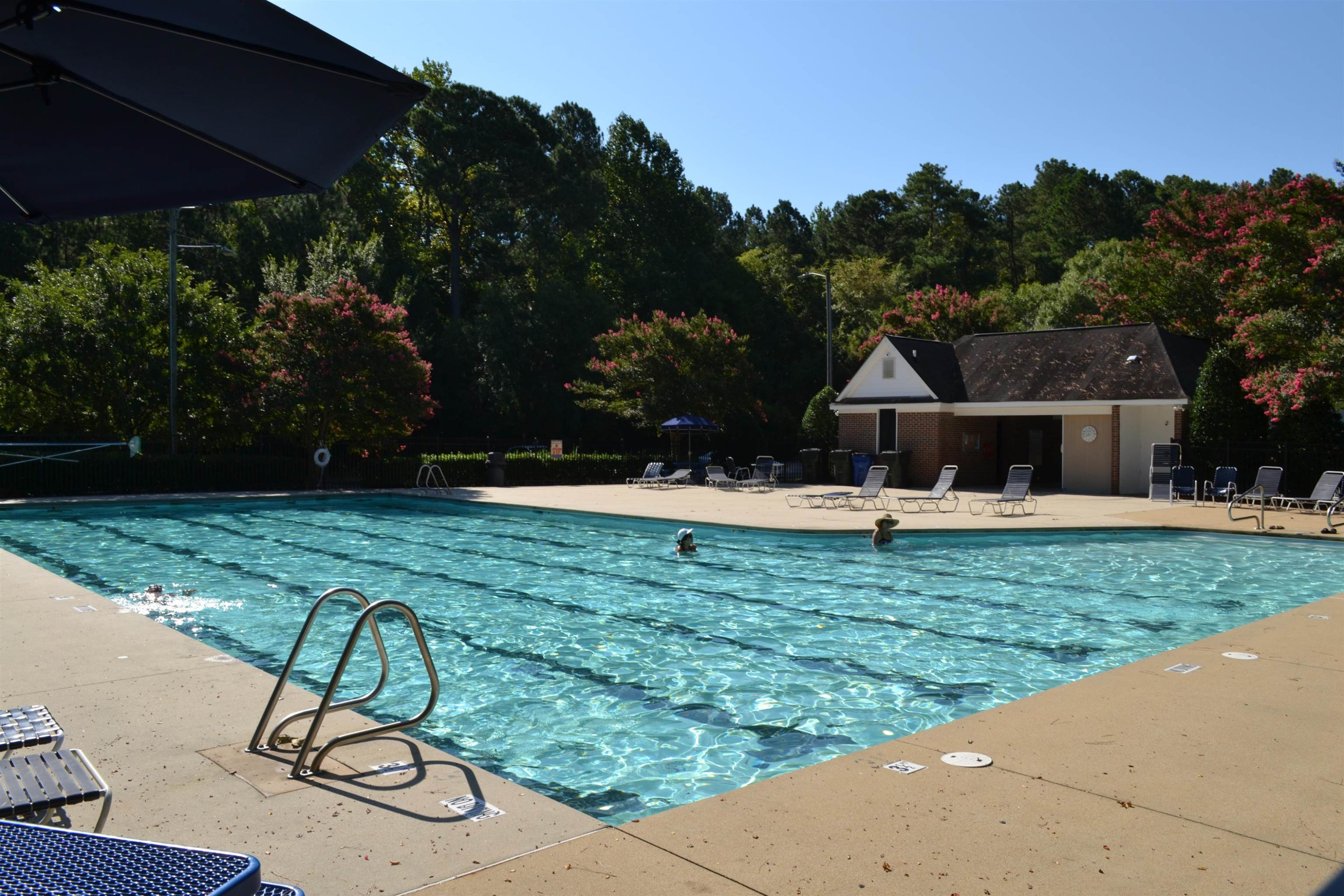 5501 Cardinal Grove Boulevard Raleigh, NC 27616 - Photo 35 of 37 a view of a swimming pool with a yard