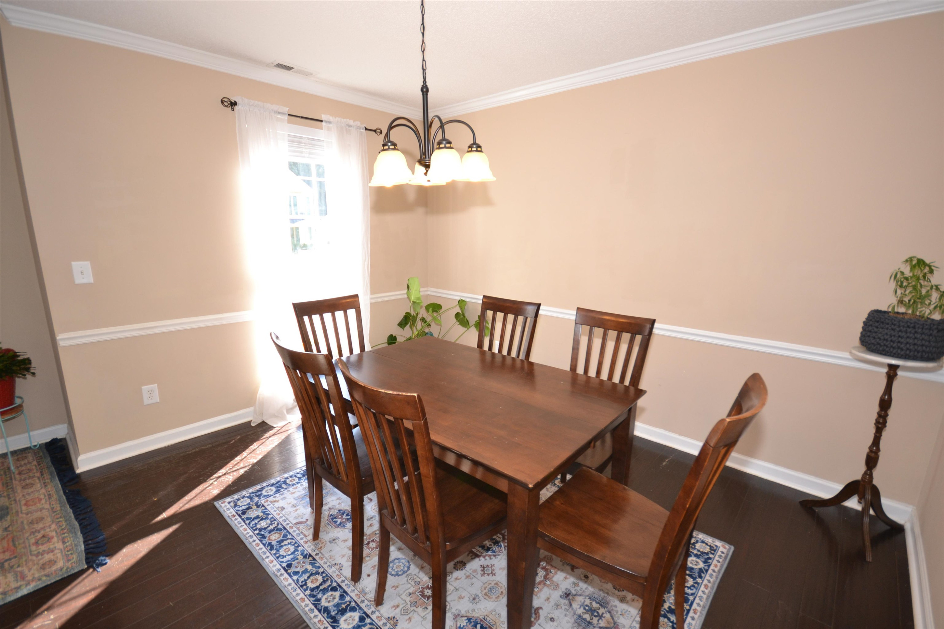 5501 Cardinal Grove Boulevard Raleigh, NC 27616 - Photo 6 of 37 a view of a dining room with furniture window and wooden floor