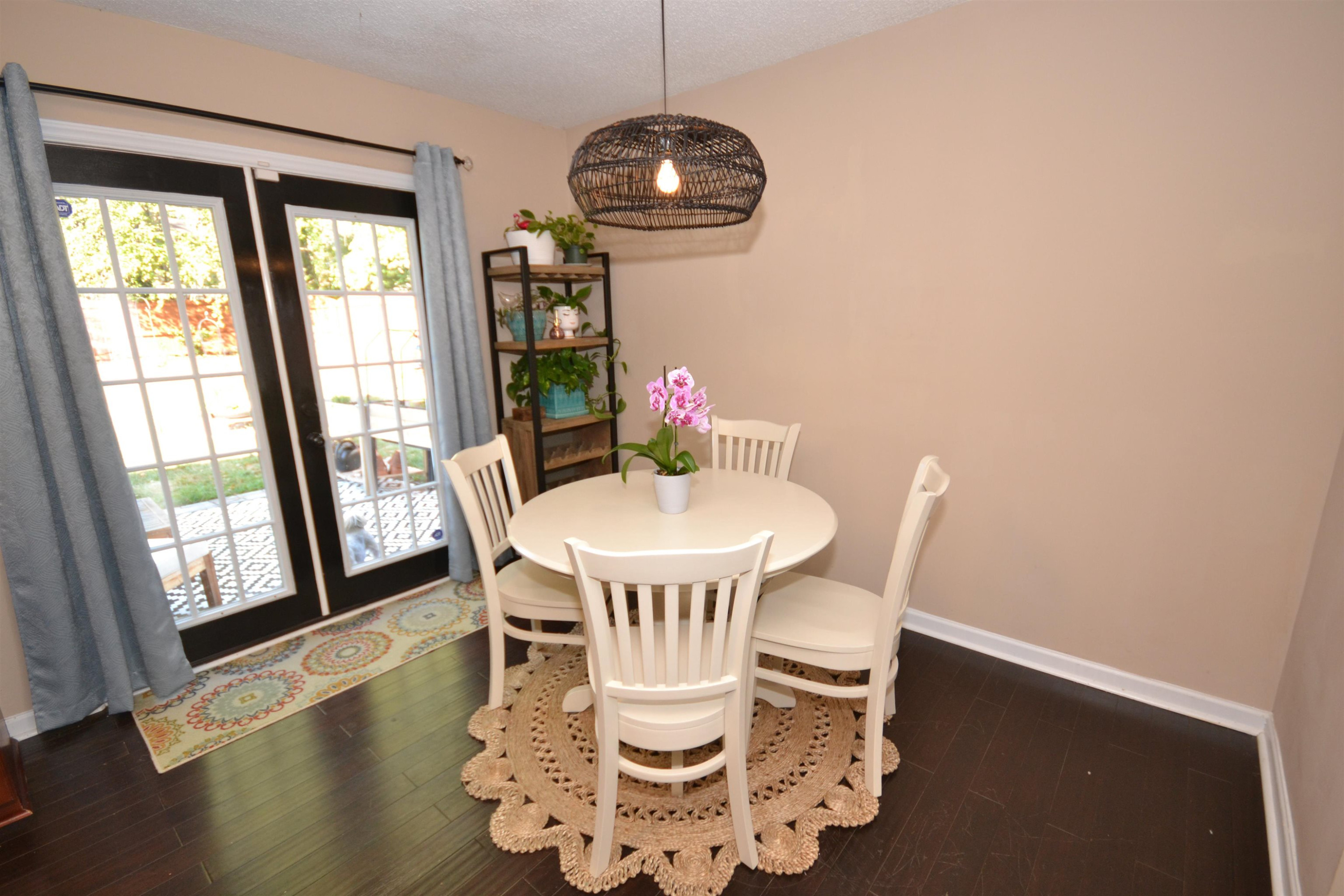 5501 Cardinal Grove Boulevard Raleigh, NC 27616 - Photo 9 of 37 a view of a dining room with furniture wooden floor and a chandelier