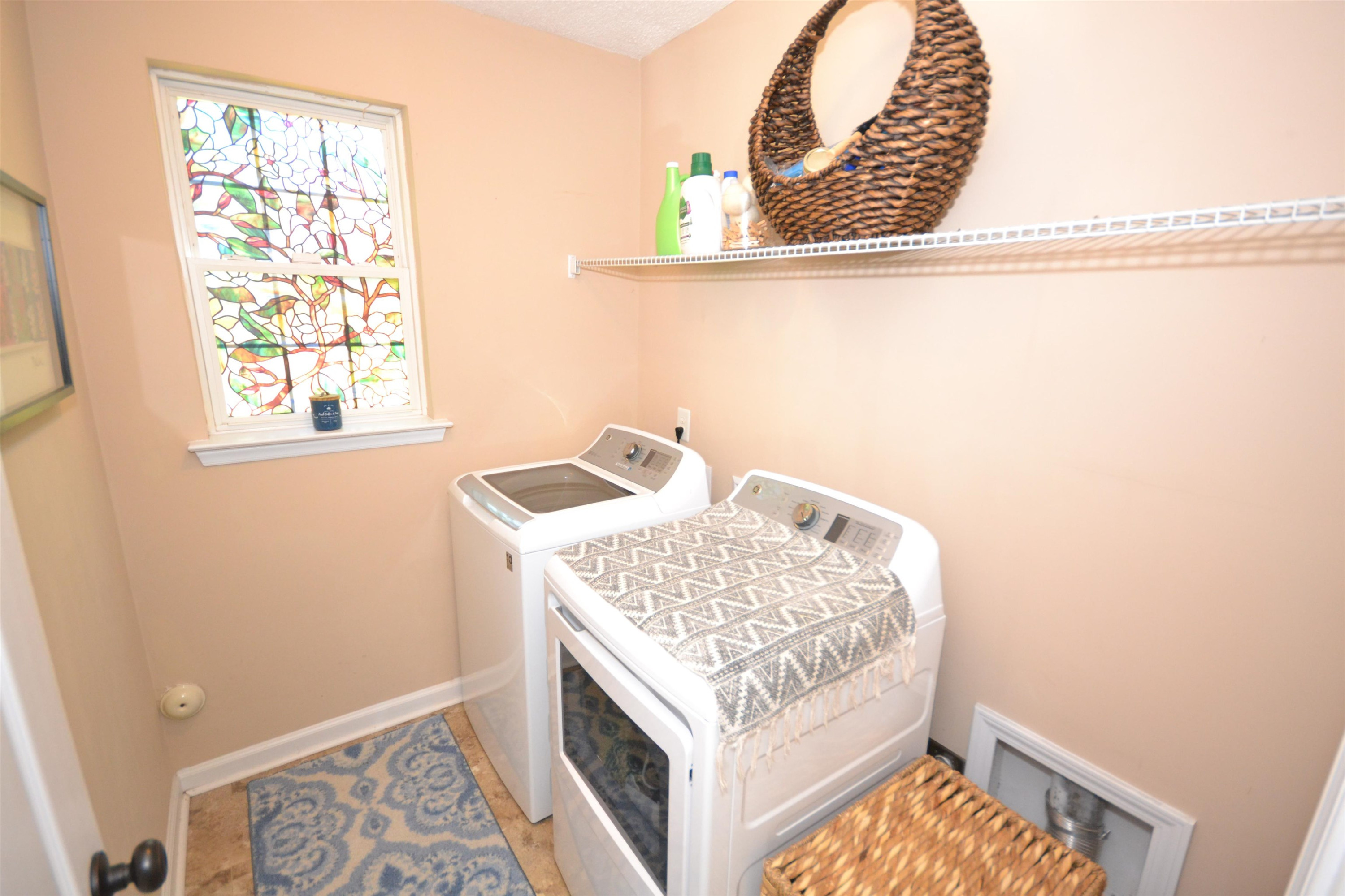5501 Cardinal Grove Boulevard Raleigh, NC 27616 - Photo 10 of 37 a bedroom with a bed and a window