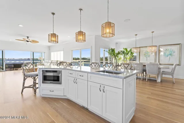 a living room with fireplace furniture and a large window