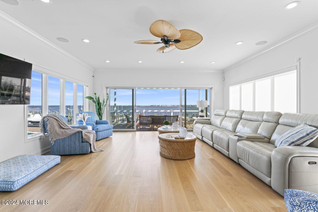 1 Pershing Boulevard Lavallette, NJ 08735 - Photo 18 of 61 a living room with couches kitchen view and a chandelier