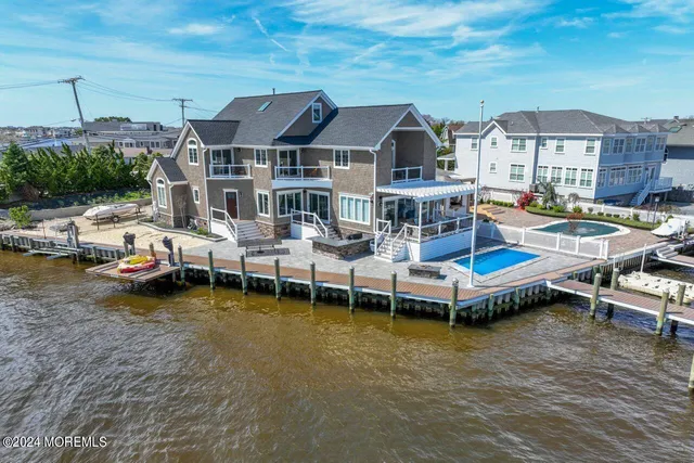 a view of a house with pool porch and sitting area