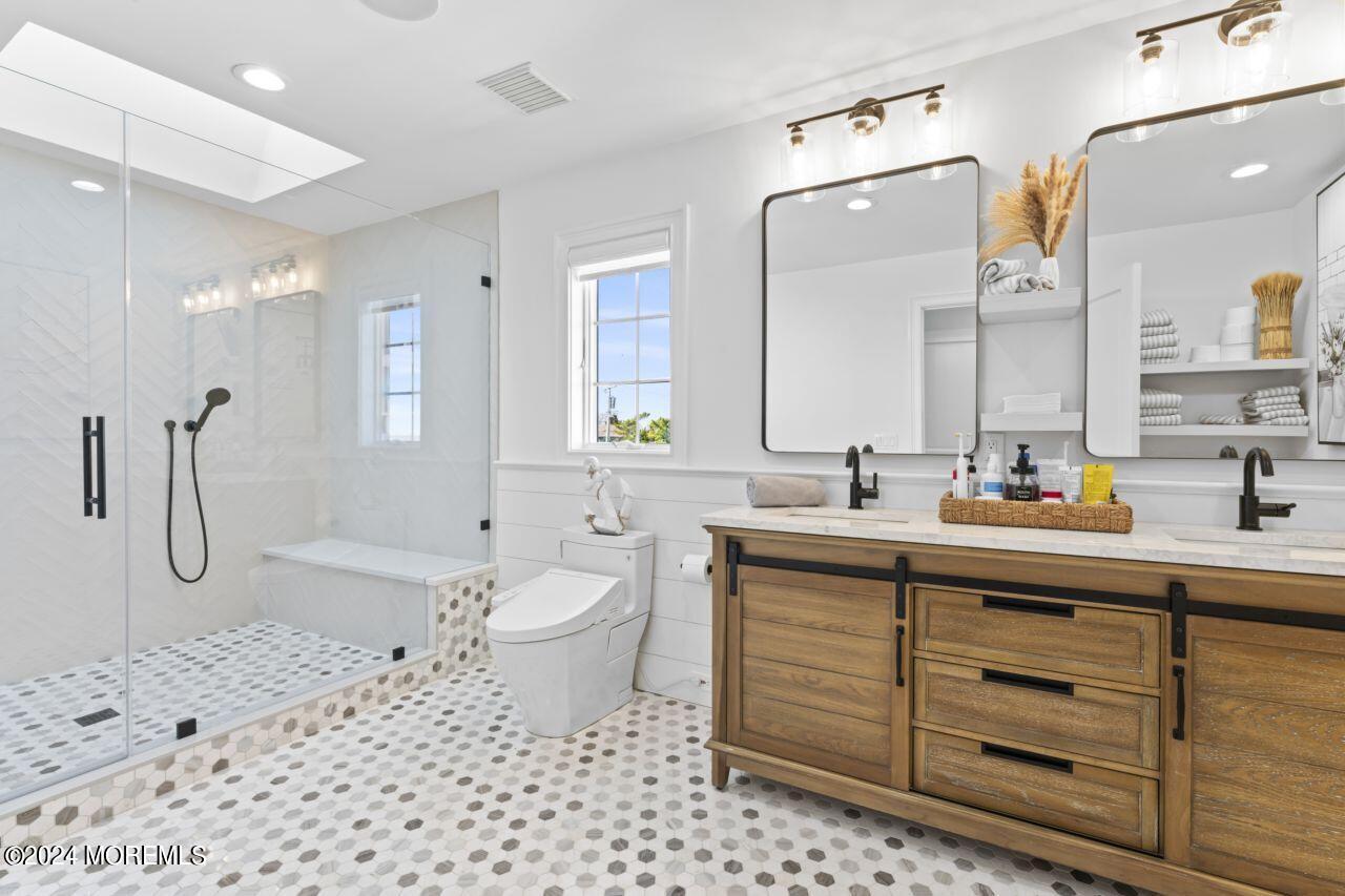 1 Pershing Boulevard Lavallette, NJ 08735 - Photo 33 of 61 a bathroom with a sink toilet and shower