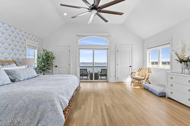 a bedroom with a bed chair and a window