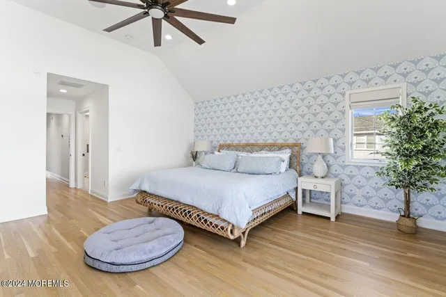 a bedroom with furniture and a window