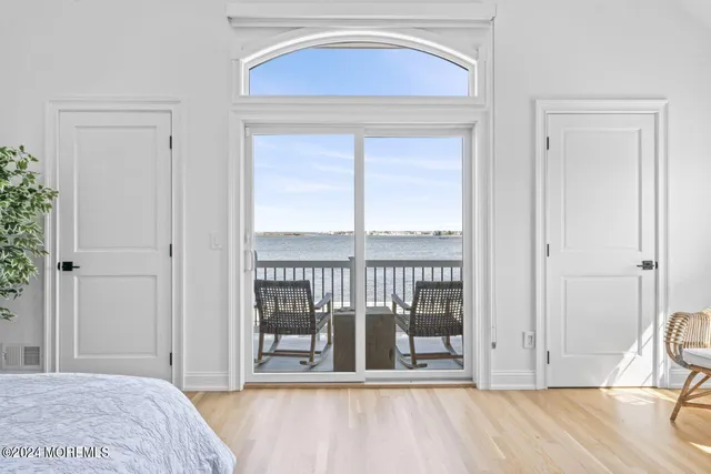 a view of a house with roof deck and sitting area