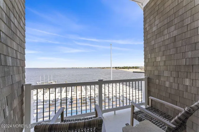 a view of houses with outdoor space and lake view