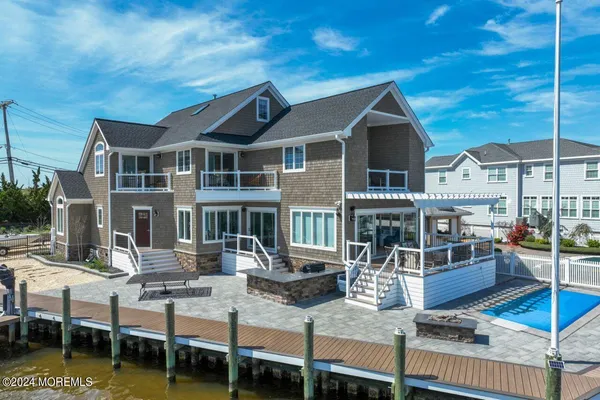 an aerial view of a house with a ocean view