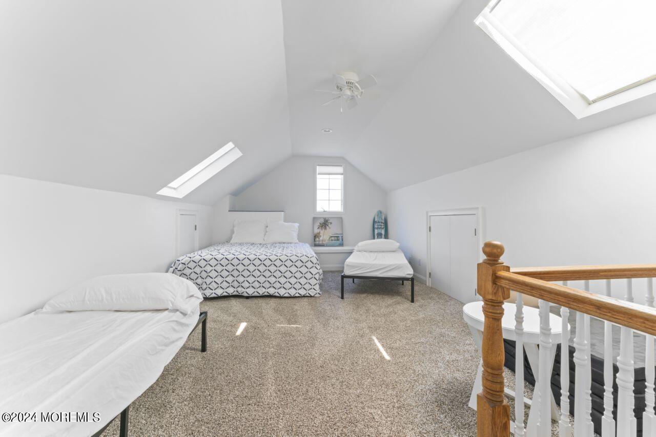 1 Pershing Boulevard Lavallette, NJ 08735 - Photo 41 of 61 a bedroom with furniture and a window