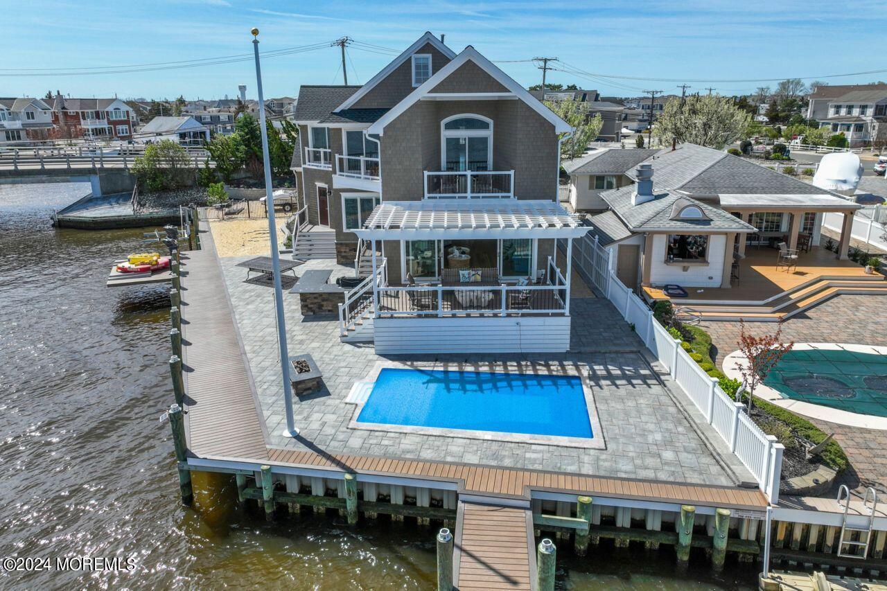 1 Pershing Boulevard Lavallette, NJ 08735 - Photo 43 of 61 a view of a house with roof deck and sitting area
