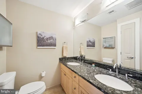 a bathroom with a shower and a sink