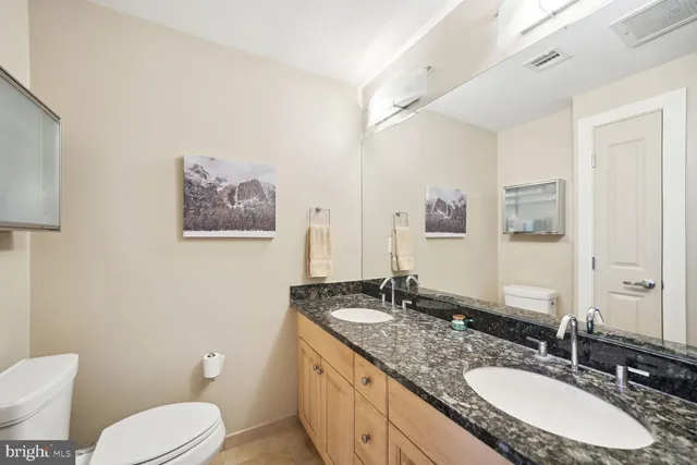 a bathroom with a shower and a sink