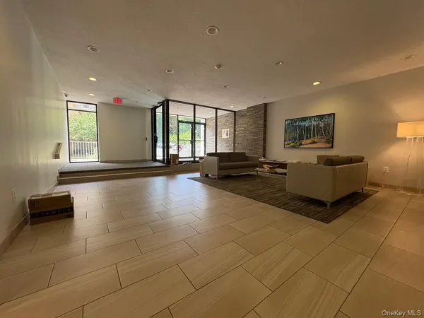a lobby with furniture and window