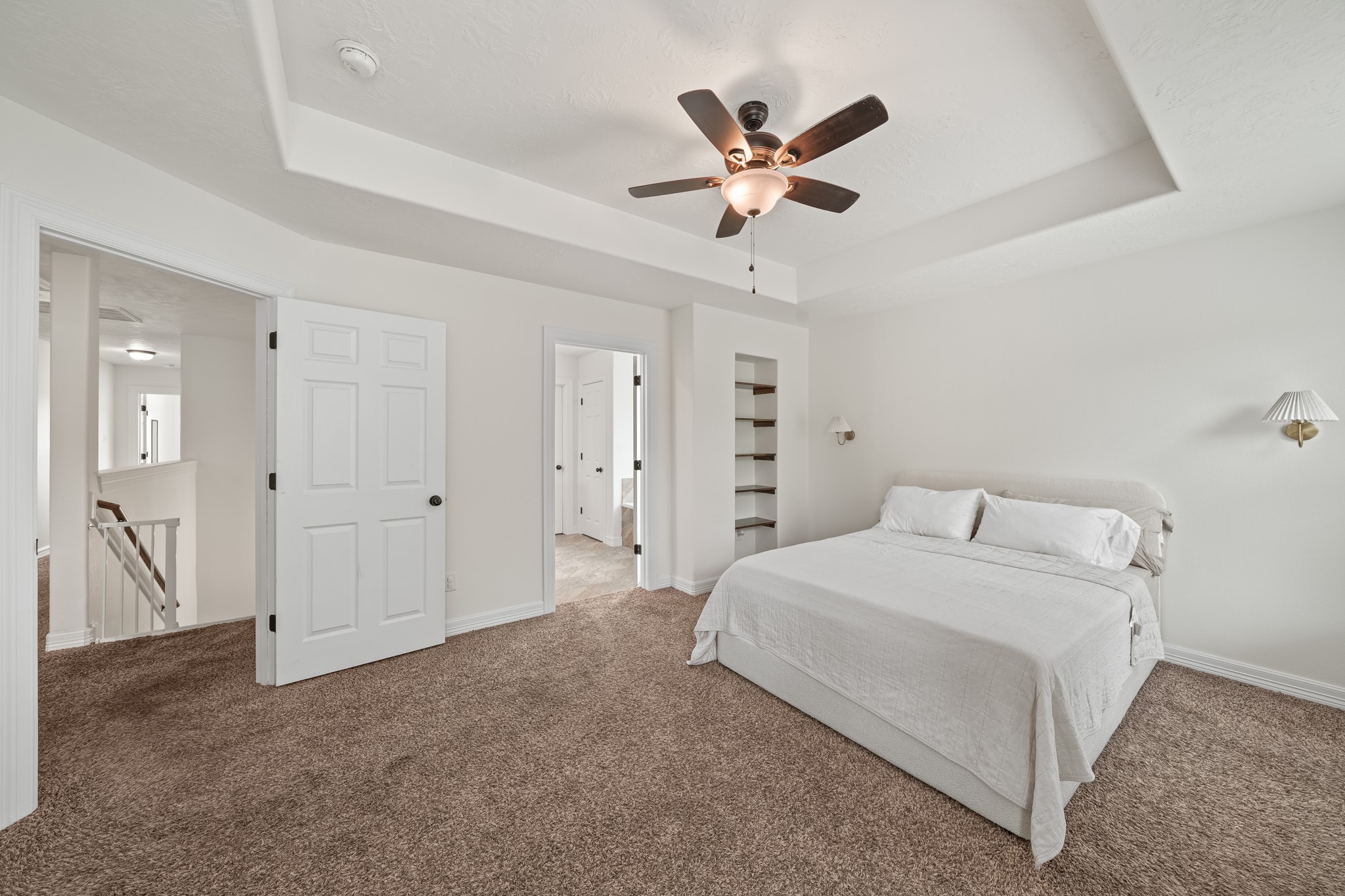 6101 Fox Ridge Drive Angleton, TX 77515 - Photo 18 of 30 a bedroom with a bed and a chandelier