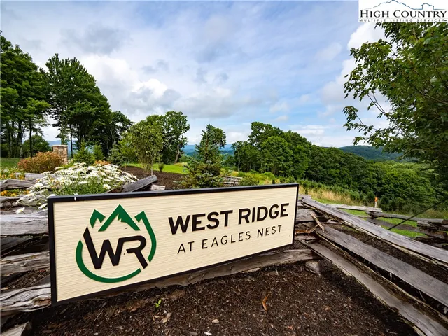 a view of a street with wooden benches