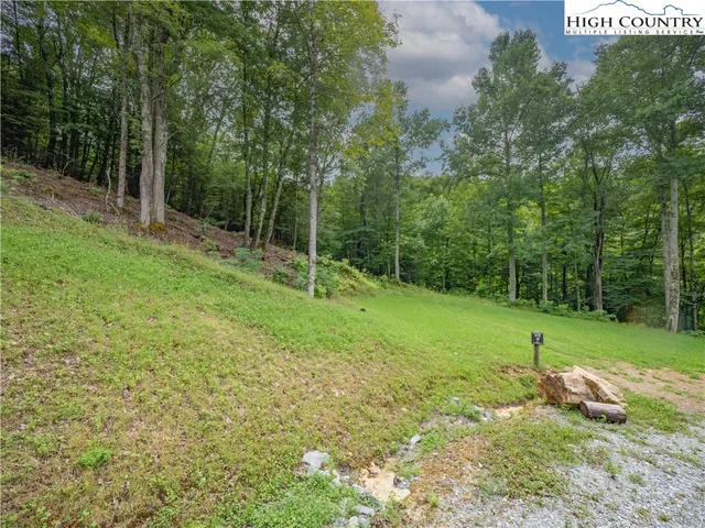 a view of outdoor space with deck and yard