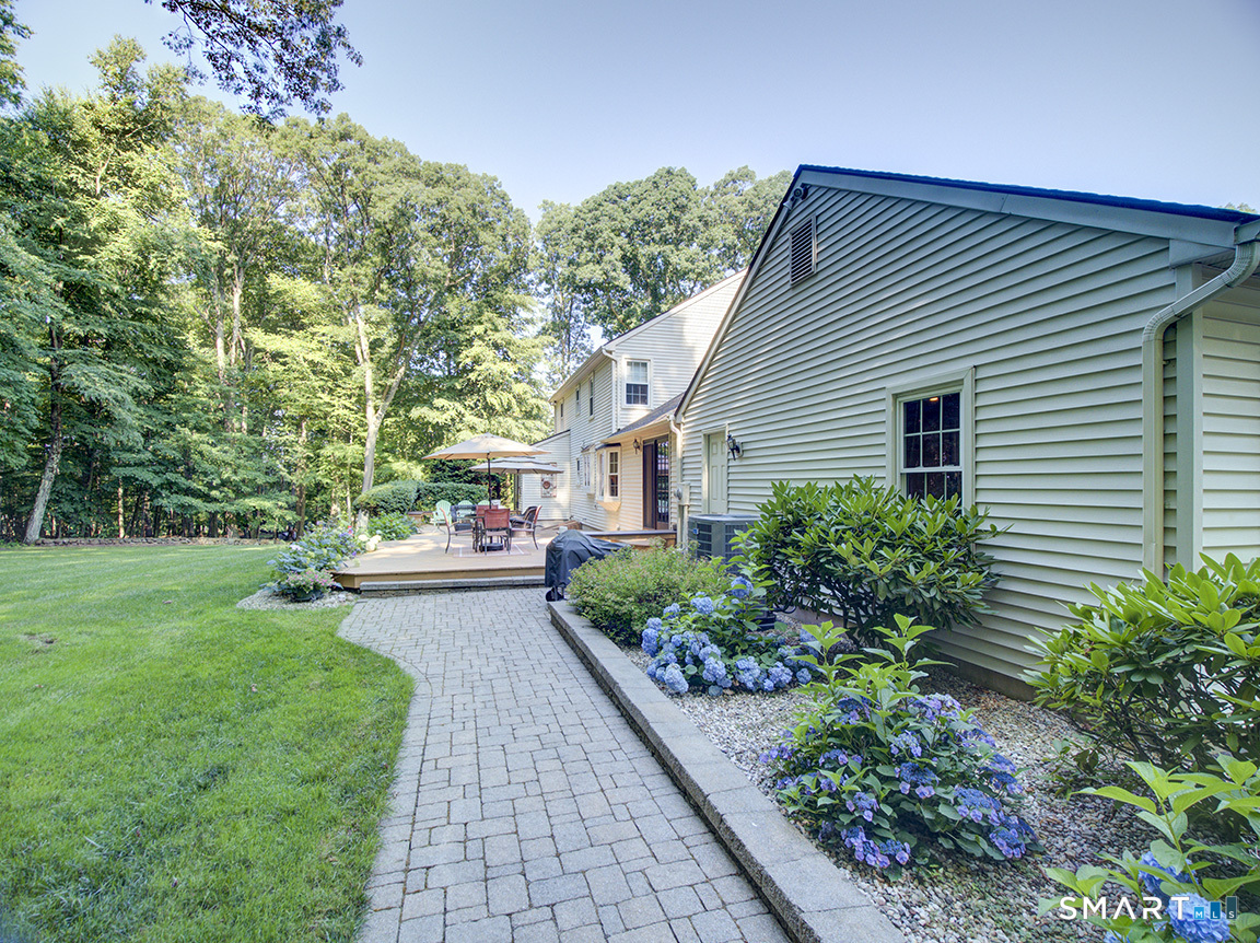 19 East Ridge Court Cheshire, CT 06410 - Photo 3 of 39 Paver walkway with gardens to rear deck.