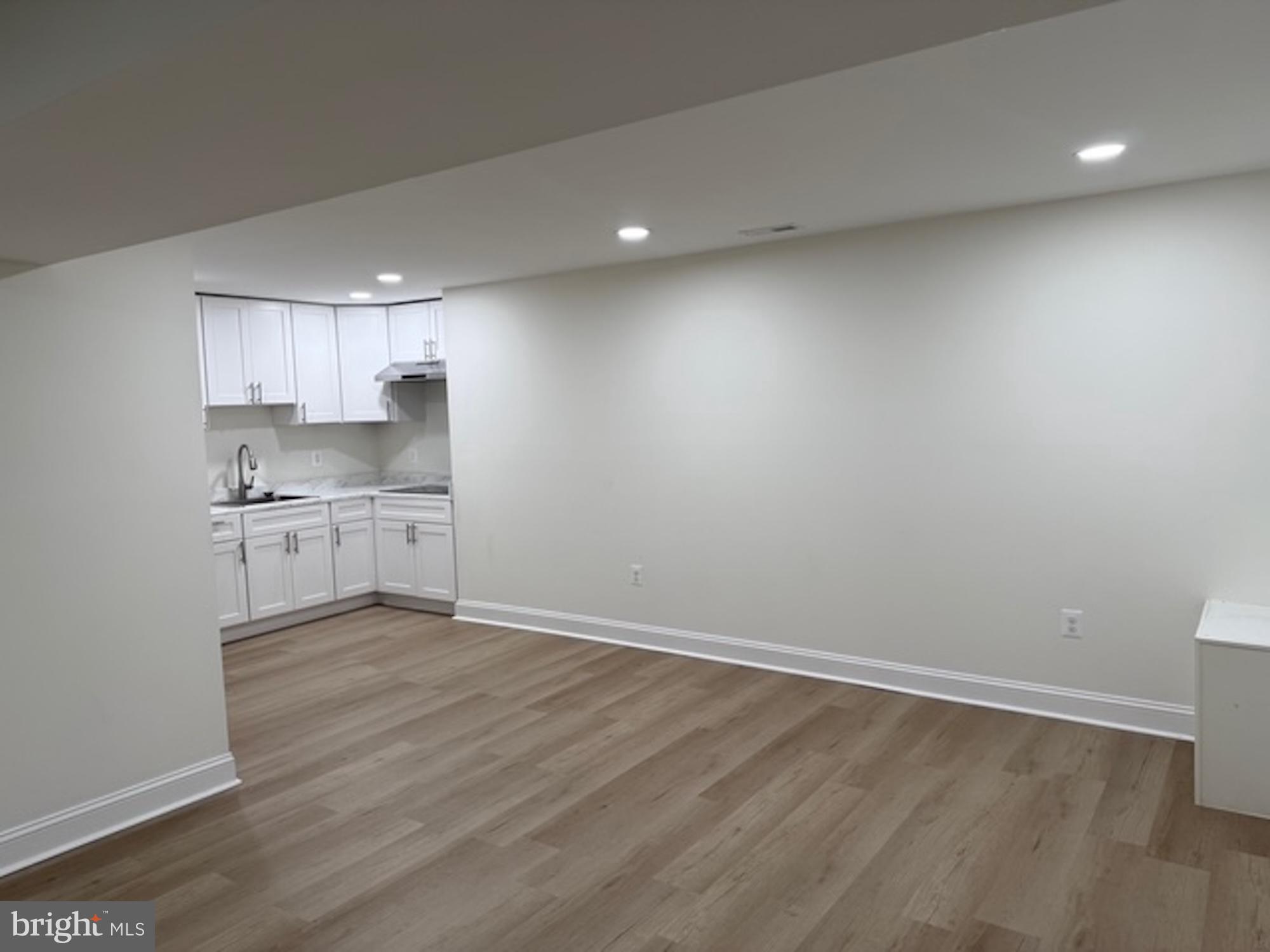 6409 63rd Place Riverdale, MD 20737 - Photo 11 of 22 a view of kitchen with wooden floor