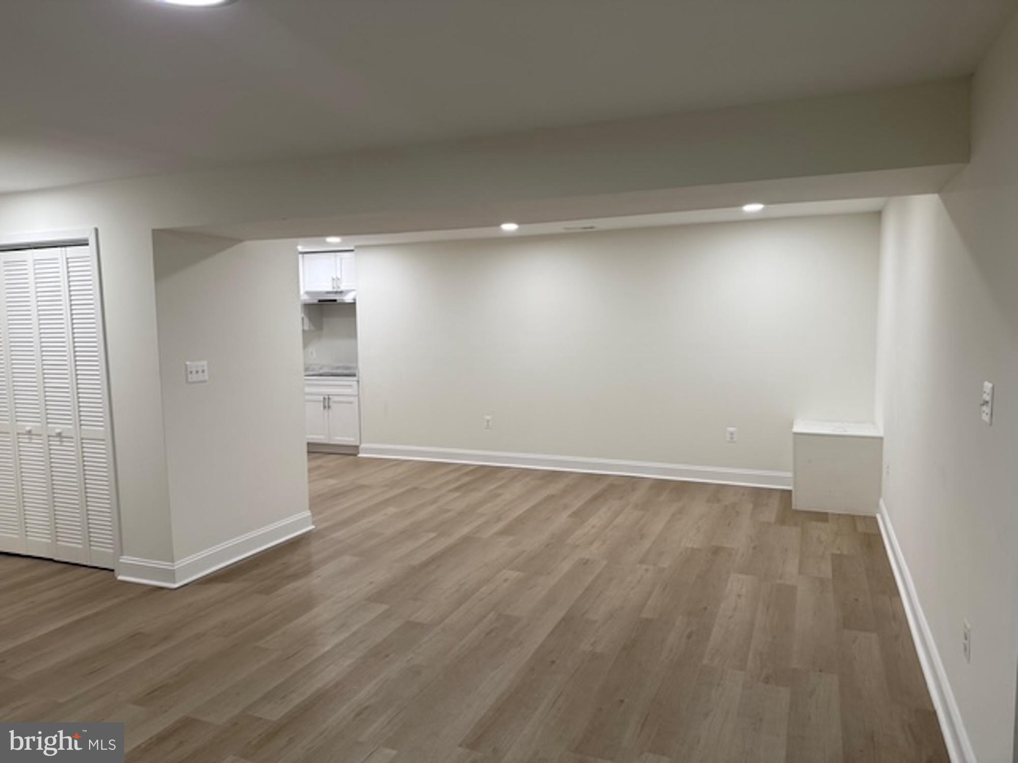6409 63rd Place Riverdale, MD 20737 - Photo 14 of 30 wooden floor in an empty room with a window