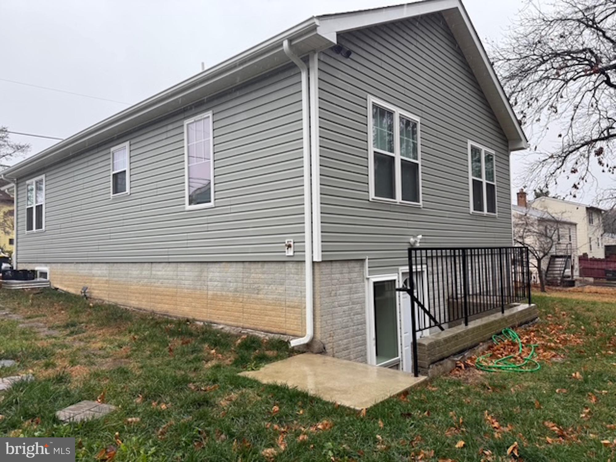 6409 63rd Place Riverdale, MD 20737 - Photo 2 of 30 a view of a house with backyard and a tree