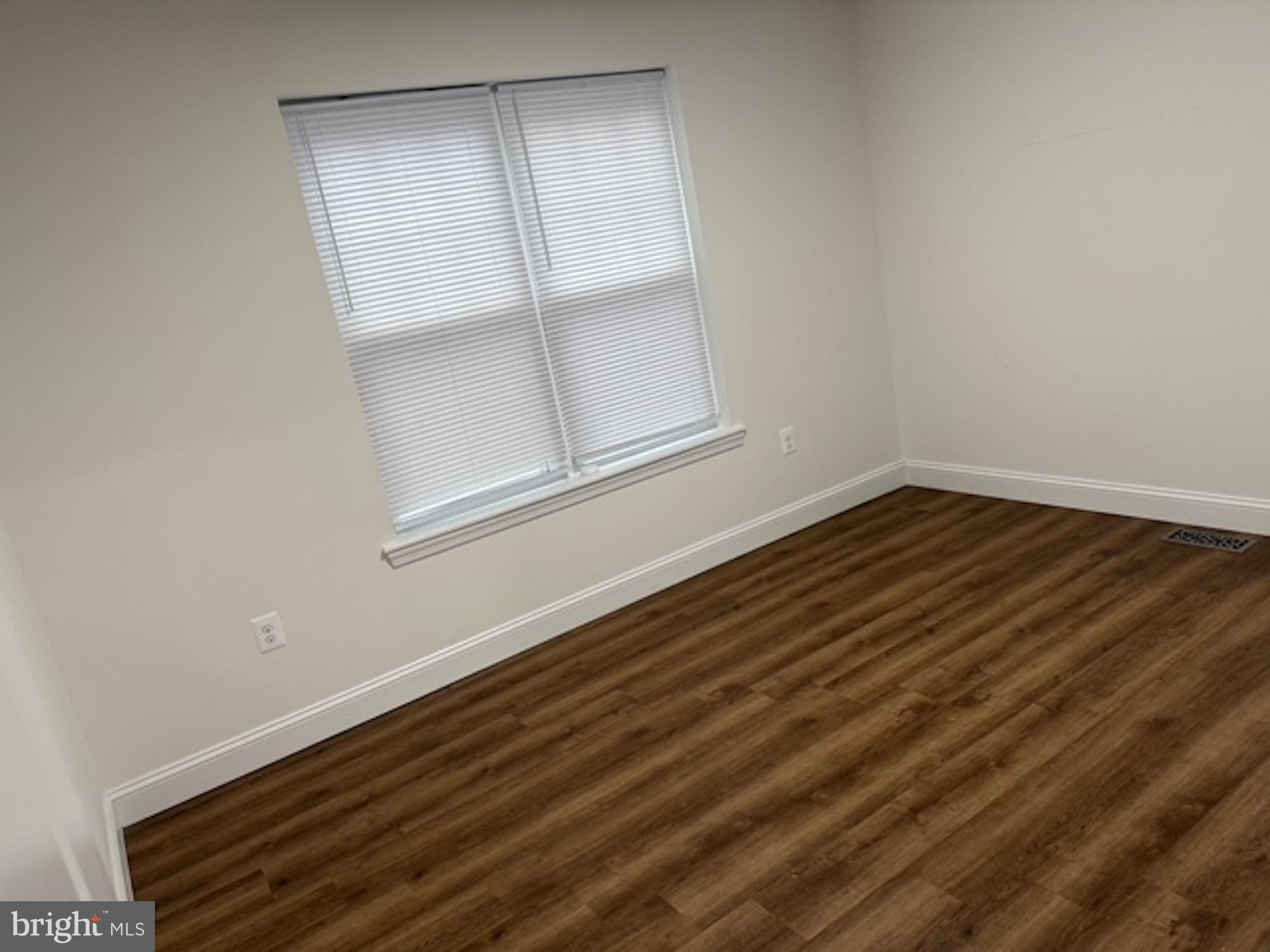 6409 63rd Place Riverdale, MD 20737 - Photo 3 of 22 a view of room with window and hardwood floor
