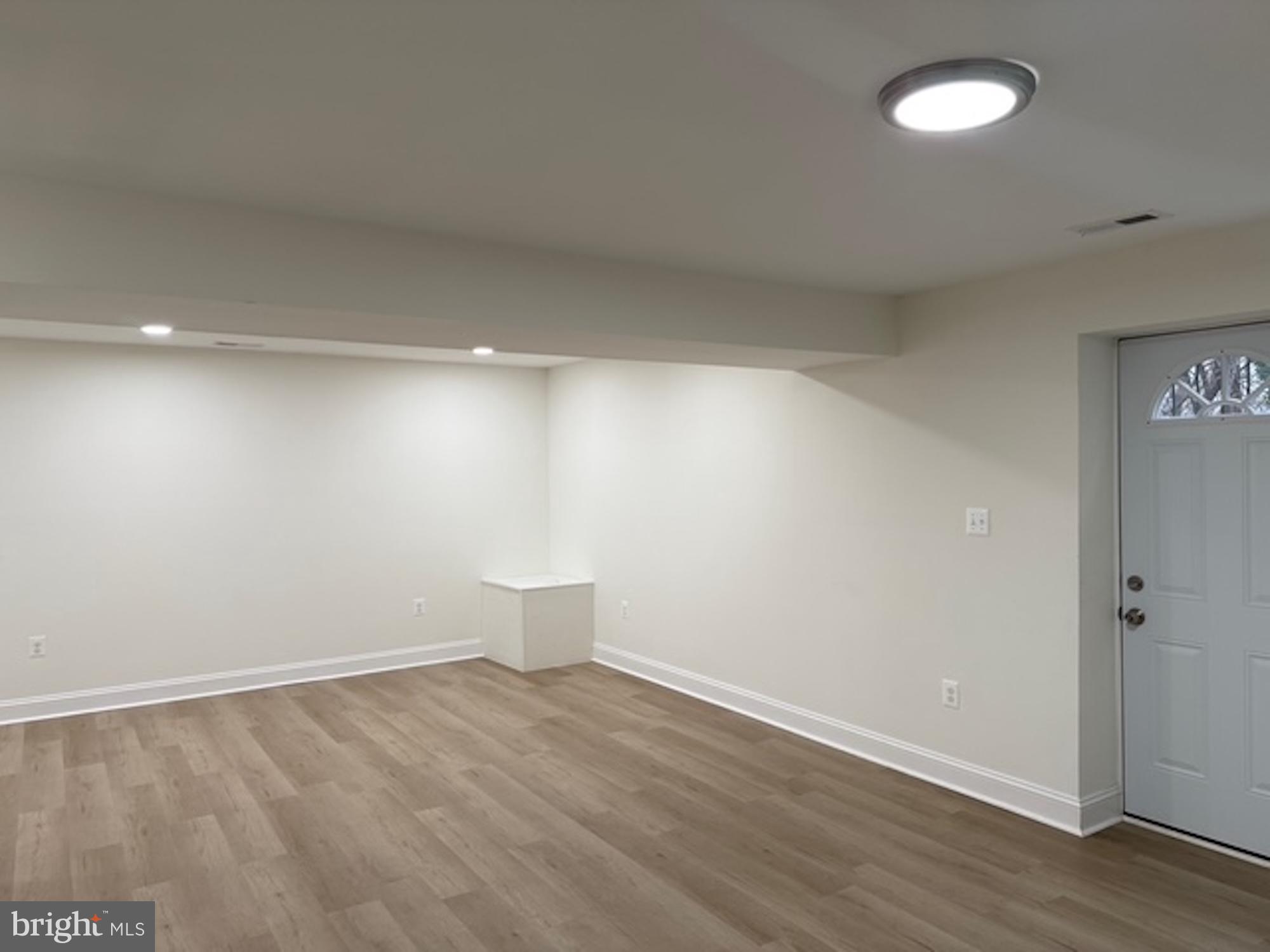 6409 63rd Place Riverdale, MD 20737 - Photo 7 of 22 a view of an empty room with a fan