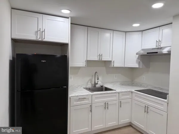 a kitchen with a sink and cabinets