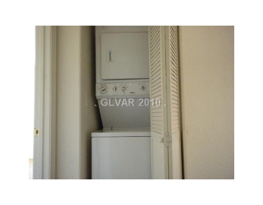 4765 Pinon Pointe Road Las Vegas, NV 89115 - Photo 11 of 16 Other. LAUNDRY AREA WITH STACK WASHER AND DRYER