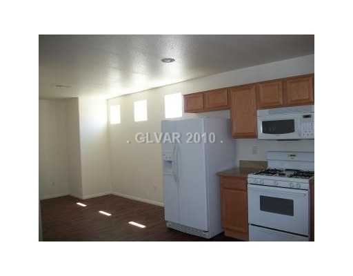 4765 Pinon Pointe Road Las Vegas, NV 89115 - Photo 15 of 16 Kitchen. NOTICE HOW LIGHT AND AIRY THE KITCHEN & DINING AREA ARE.